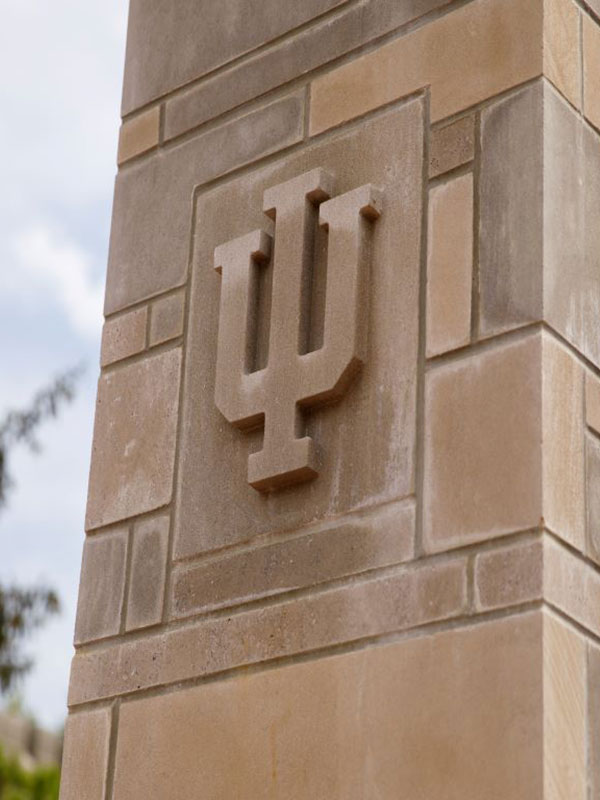 A relief of the IU trident in a limestone column.