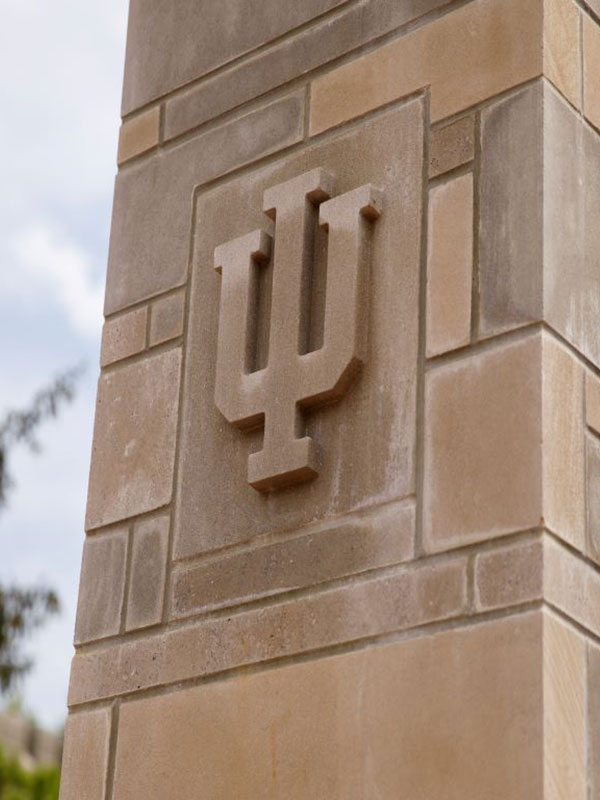 A limestone column with the IU trident on it.